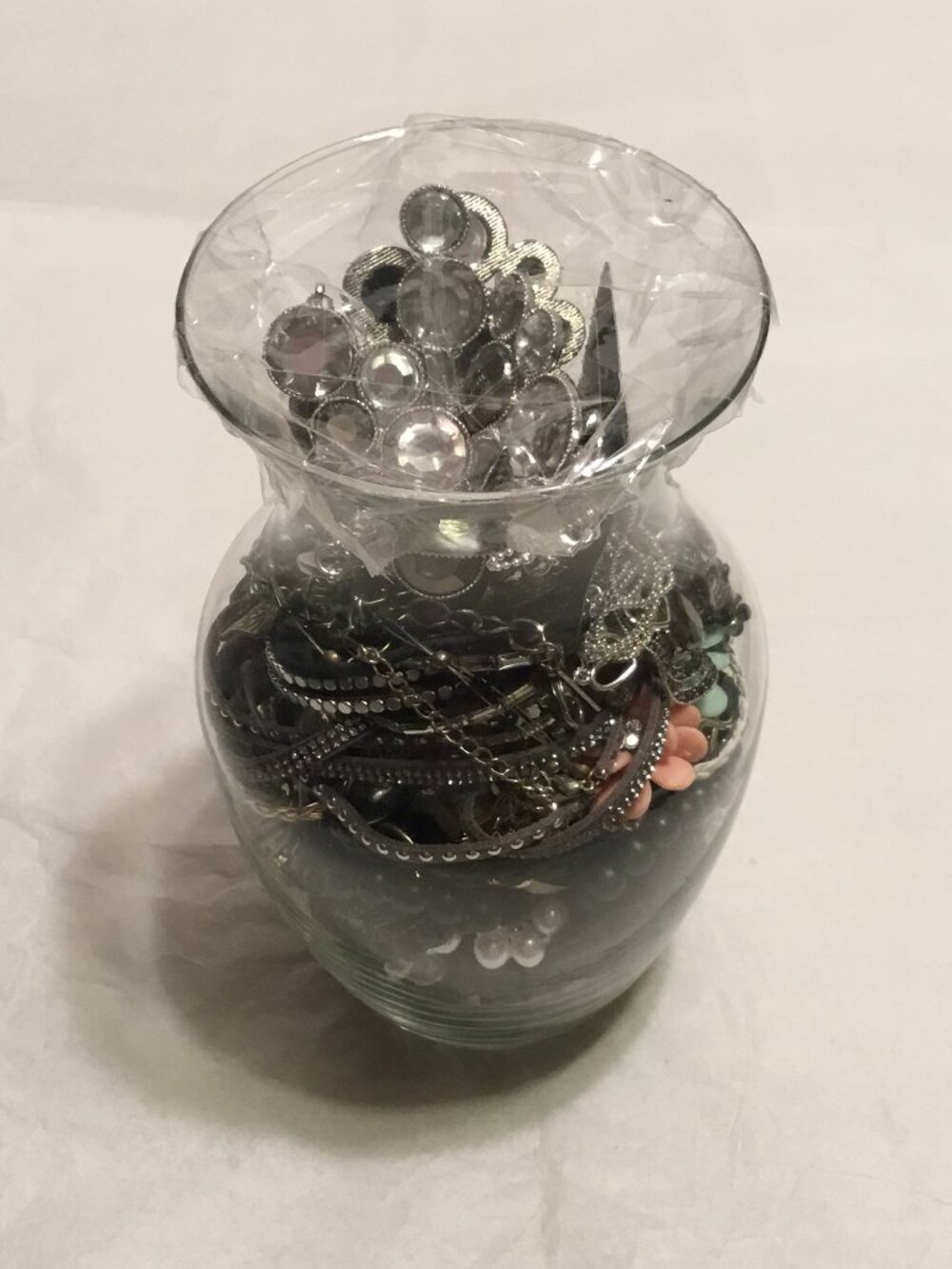 Large, heavy vase filled with lots of good, wearable or resaleable jewelry